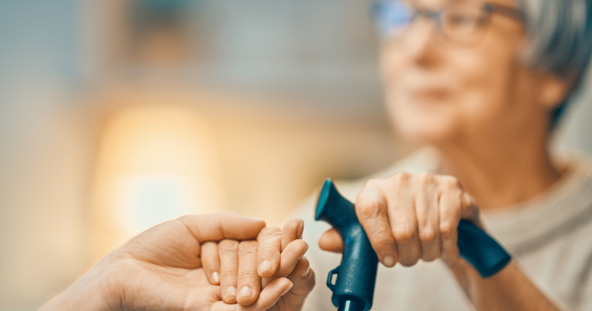 What’s an Adult Family Home and is it Right for Your Loved One? elderly woman with cane in one hand getting support from helping hand in the other